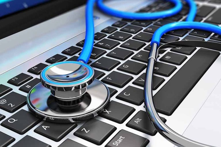 Stethoscope resting on a laptop keyboard, symbolising telemedicine or digital health.